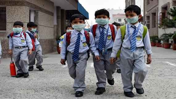 GHAZIABAD, INDIA - NOVEMBER 4: School students have started wearing face masks to school after pollution levels increased after Diwali on November 4, 2016 in Ghaziabad, India. The toxic smog choked the capital and the surrounding areas with visibility reducing to the second lowest recorded in at least 10 years for November and one monitoring agency showing that the city's air quality index had again gone off the scale at 500+, a level it had reached a day after Diwali. (Photo by Sakib Ali/Hindustan Times via Getty Images)